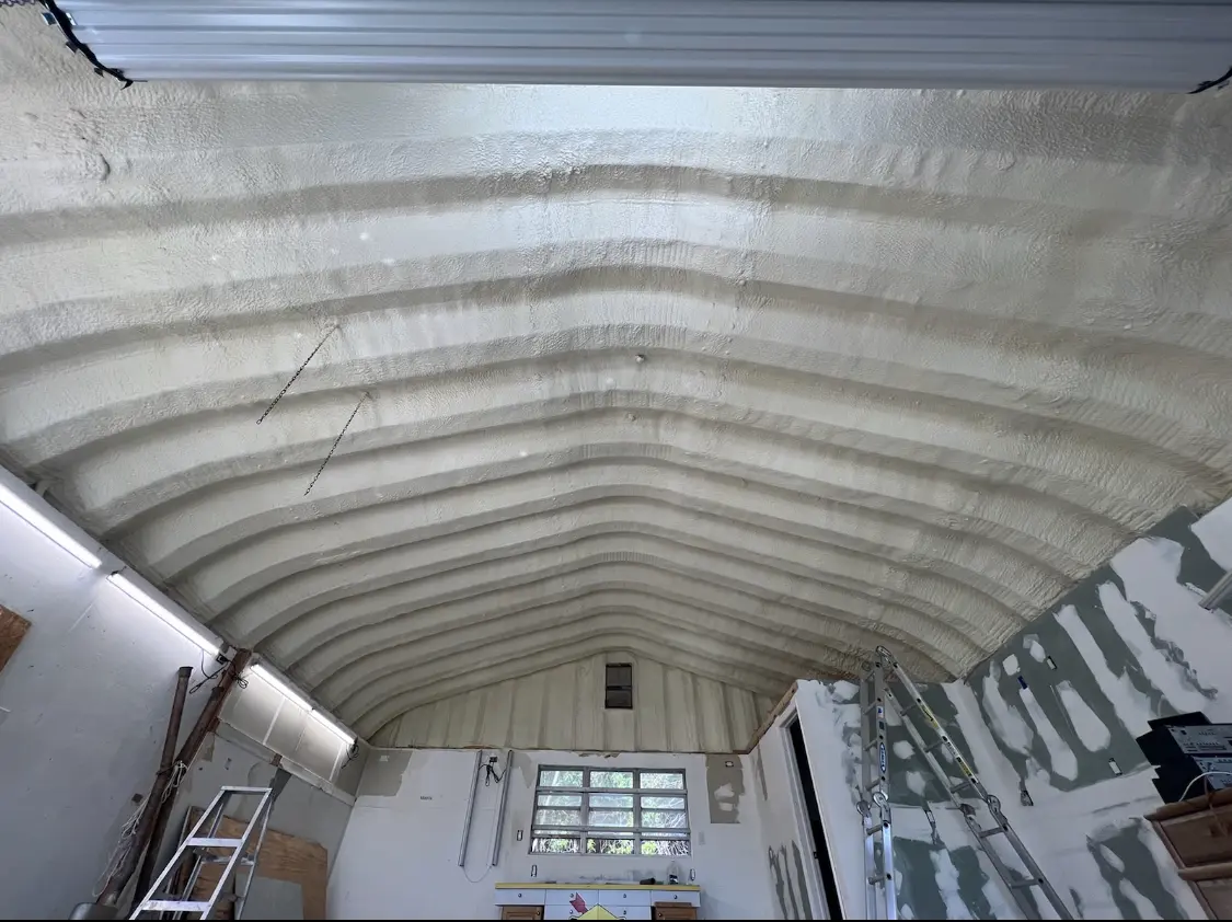 Spray polyurethane foam applied to the underside of a metal roof deck in Riverside